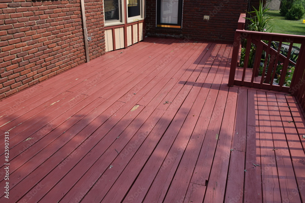 Red Boards on the Deck of a House