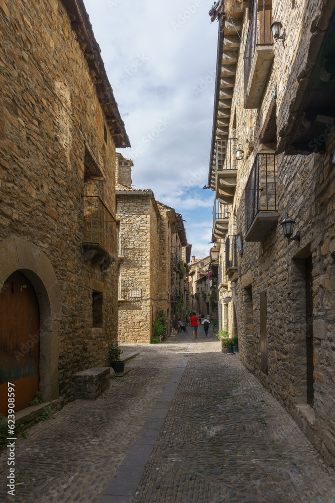 Street with stone houses in the medieval village of Ainsa in the pyrenees, Aragon, Spain