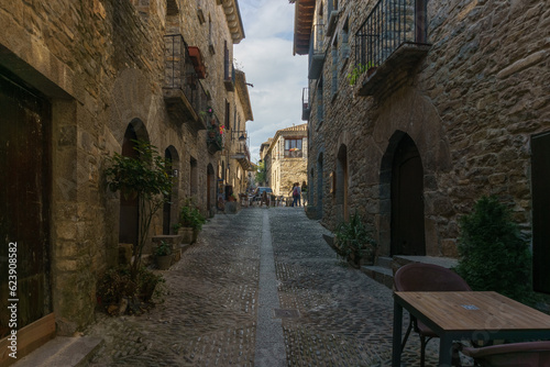 Street with stone houses in the medieval village of Ainsa in the pyrenees, Aragon, Spain