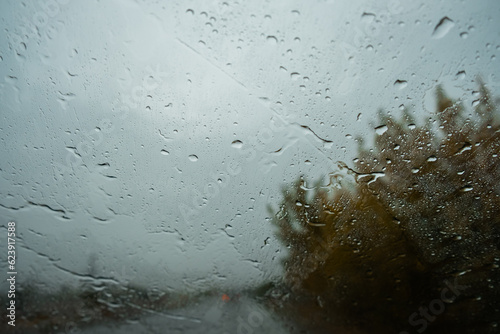 car windshield wipers clean glass from rain close up