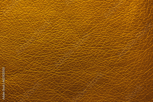 Golden textured surface as background, closeup view