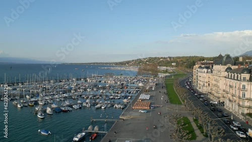 Flying over the lakeside promenade in Geneva - aerial view by drone