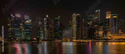 Landscape view of Singapore business district and city night district dusk sky. Singapore cityscape at dusk building around Marina bay. Concept of Travel trip in asia cityscape landmark © banphote