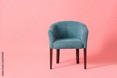 Soft armchair on pink background