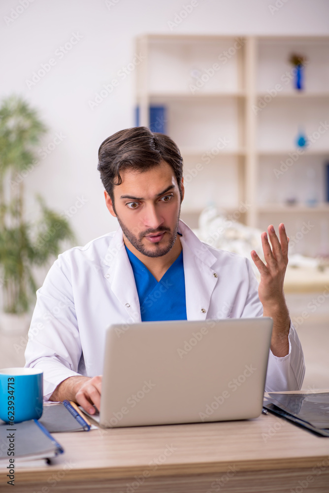 Young male doctor in telemedicine concept Young male doctor in telemedicine concept