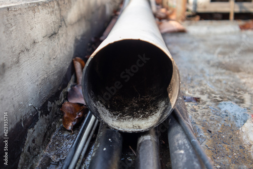 dirty and mossy water pipe holes