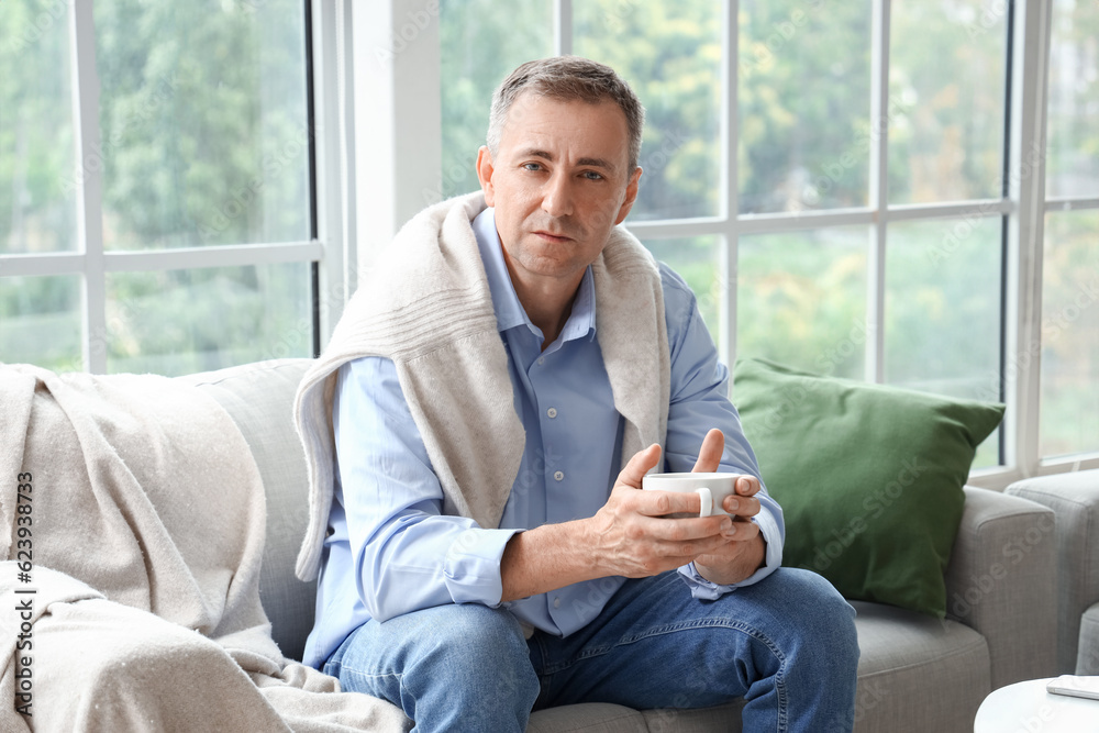 Mature man drinking tea on his day off at home Mature man drinking tea on his day off at home