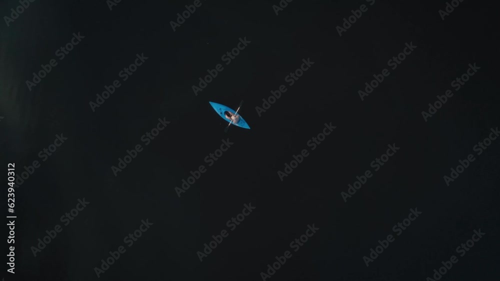 Kayaker In A Lake From Above Kayaker In A Lake From Above