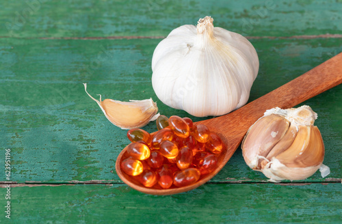 Garlic bulbs, garlic cloves, capsules of oil.