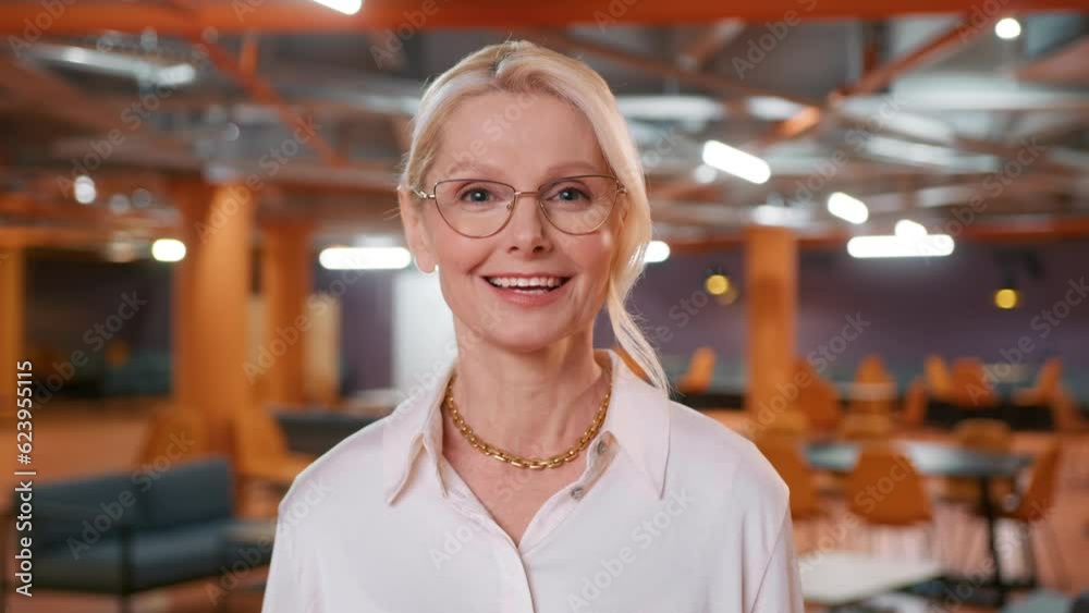 Head shot portrait mature blonde woman 50s in eye wear talk to webcam on videoconference call, negotiating remotely contract with clients using internet connection technologies. Video call job office Head shot portrait mature blonde woman 50s in eye wear talk to webcam on videoconference call, negotiating remotely contract with clients using internet connection technologies. Video call job office