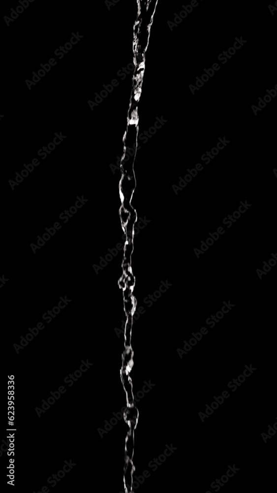 Medium shot water flowing smoothly in a thin stream in the center of the shot, on a dark background. Vertical shot. Medium shot water flowing smoothly in a thin stream in the center of the shot, on a dark background. Vertical shot.