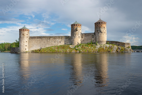 View of the towers of the ancient fortress Olavinllinna on a sunny June evening. Savonlinna, Finland