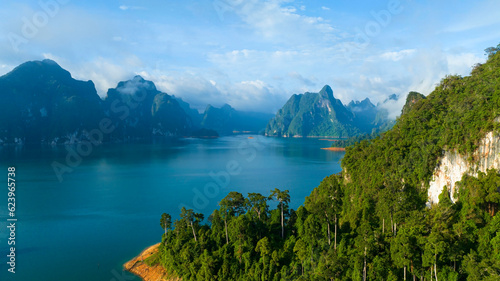 Aerial view at Khao Sok national park Cheow Lan Dam lake with blue sky background in Surat Thani, Thailand