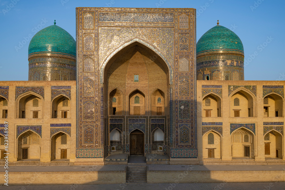 Facade of the ancient Mir-i-Arab madrasah on a sunny evening, Bukhara