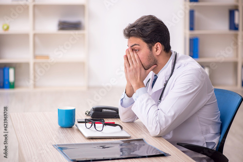 Young male doctor working in the clinic