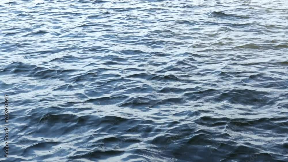 The water wave in lake. Soft blue water wave. Nature surface background texture. The water wave in lake. Soft blue water wave. Nature surface background texture.