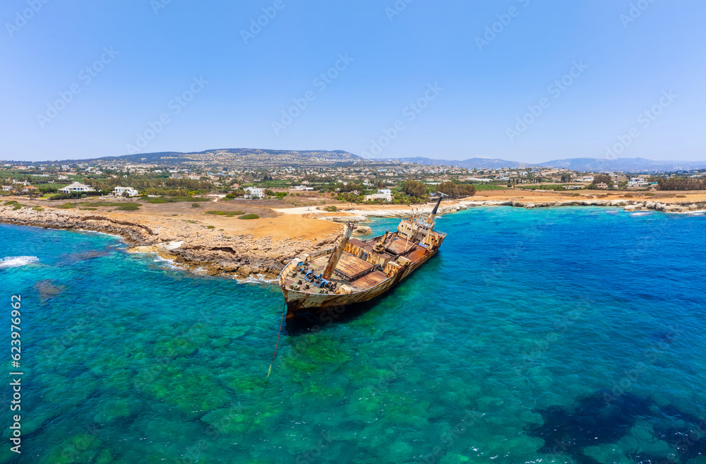 Old ship wreck on sea coast. Blue sea water in summer. Paphos, Cyprus