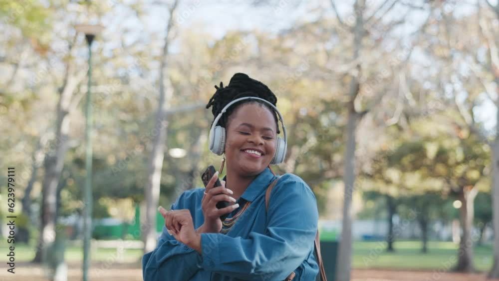 African business woman, headphones and dancing outdoor with music in park with smile, moving and summer. Black entrepreneur, smartphone and sound tech for audio streaming service in nature with dance