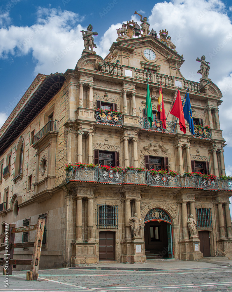 View of Consistorial Square and Town Hall building in Pamplona. Spanish and Navarra Flag, Spain, Basque Country