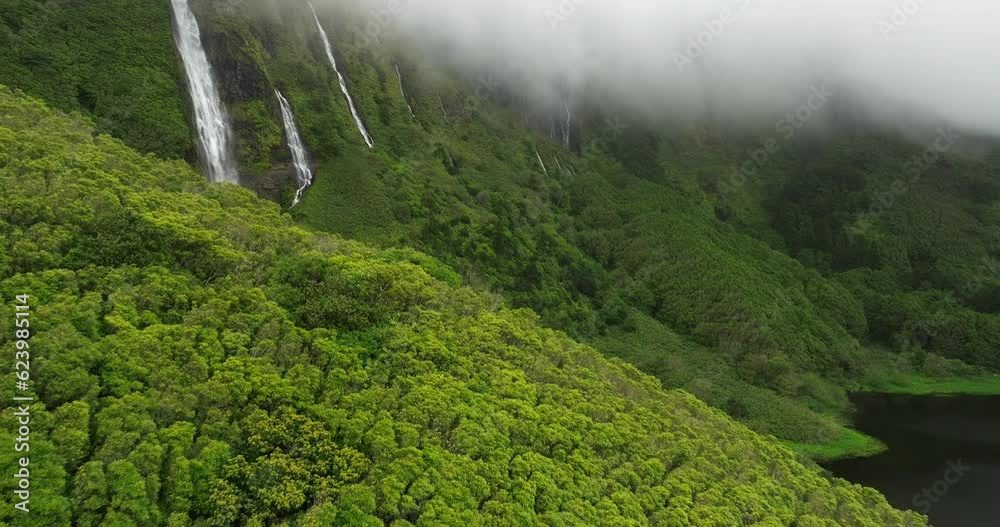 Flores island aerial view in Azores Ribeira do Ferreiro waterfalls in fog day