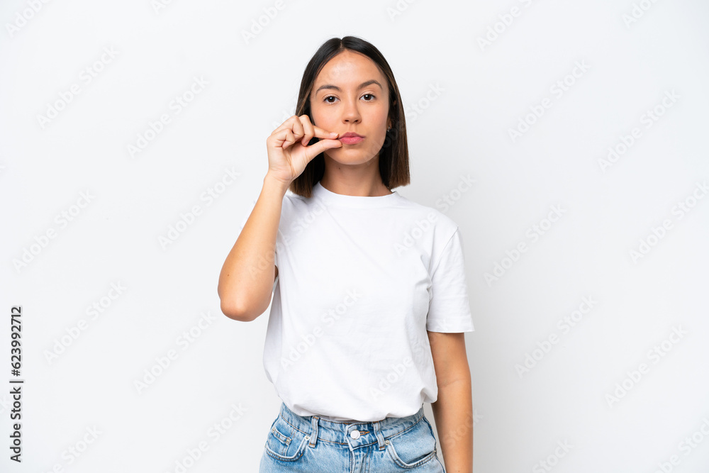 Young caucasian woman isolated on white background showing a sign of silence gesture Young caucasian woman isolated on white background showing a sign of silence gesture