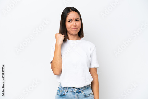 Young caucasian woman isolated on white background with unhappy expression © luismolinero