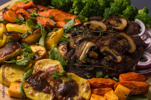 grilled vegetables with meat and mushrooms.