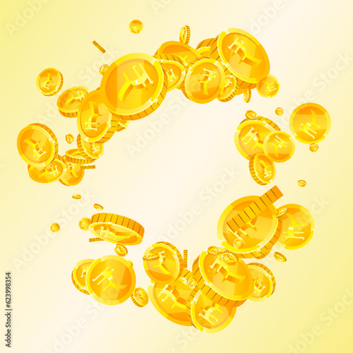 Indian rupee coins falling. Scattered gold INR