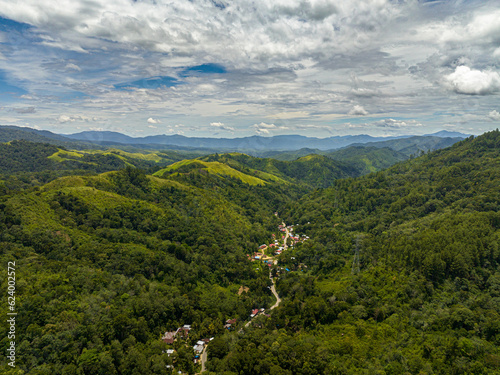 Aerial view of mountain slopes covered with rainforest and jungle. Sumatra, Indonesia.