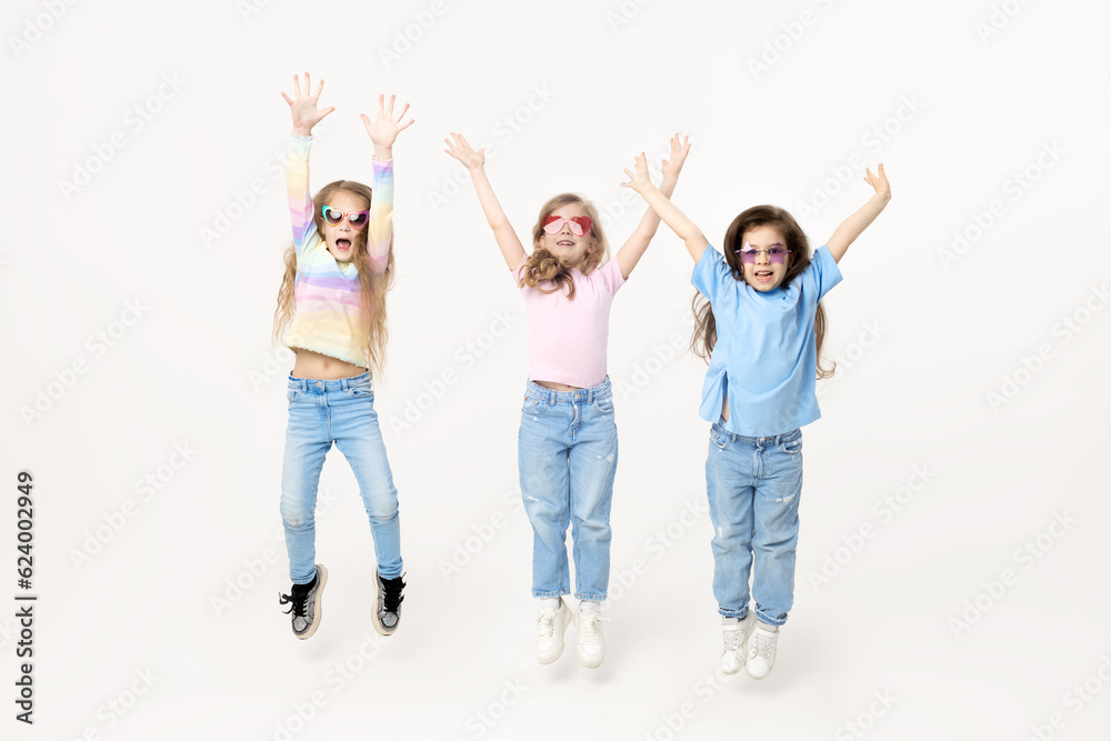 Group portrait of kids girls friends on white studio background. Happy children, cute girls hugging and having fun in carnival glasses. funny faces Group portrait of kids girls friends on white studio background. Happy children, cute girls hugging and having fun in carnival glasses. funny faces
