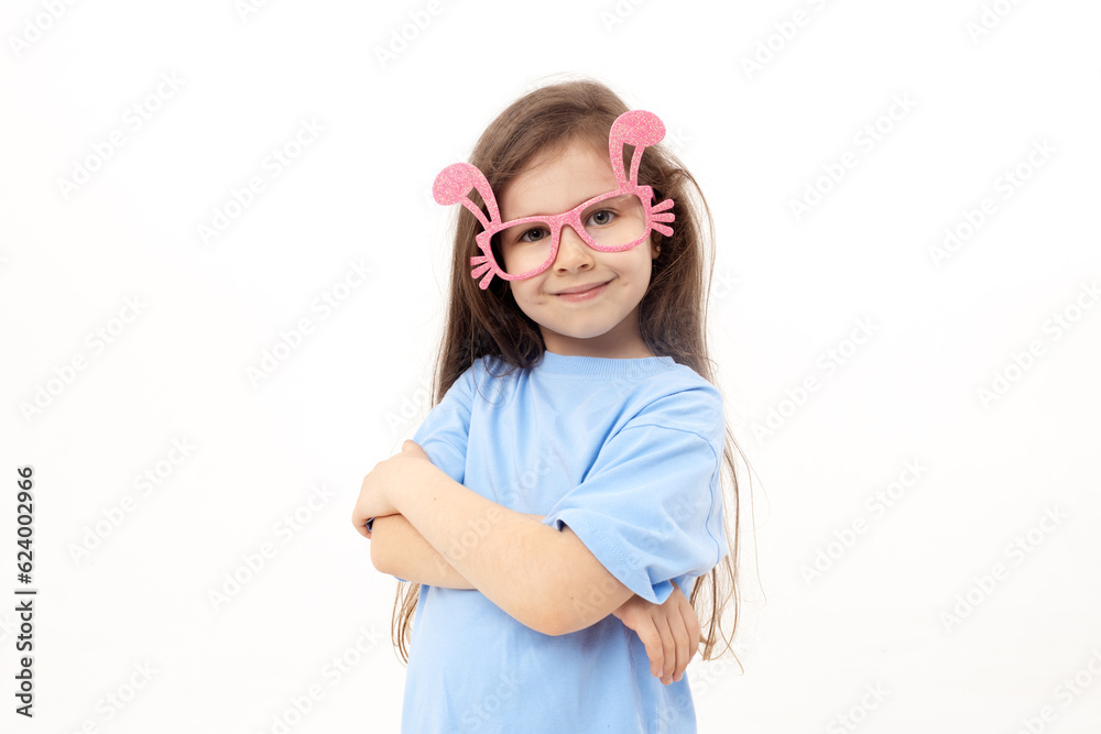 Cute little child girl wearing bunny ears glasses a on Easter day. Easter girl portrait on white background, funny emotions, surprise Cute little child girl wearing bunny ears glasses a on Easter day. Easter girl portrait on white background, funny emotions, surprise