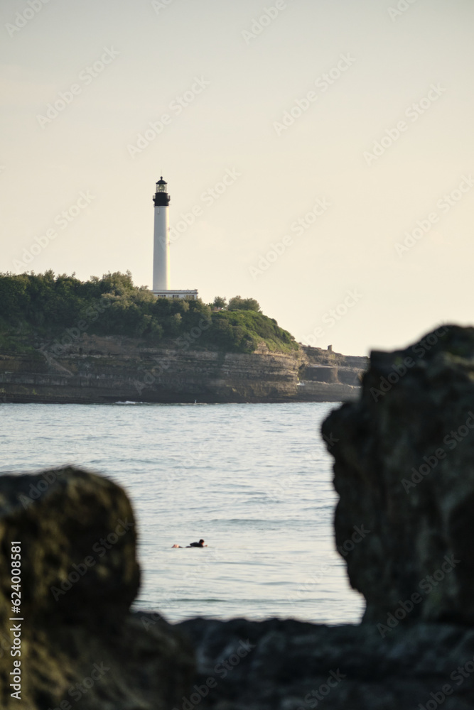 admiring the lighthouse from the rocks
