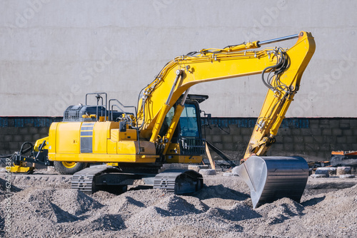 yellow excavator on a construction site