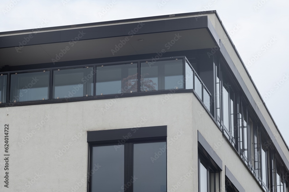 facade of a modern office building with many windows facade of a modern office building with many windows
