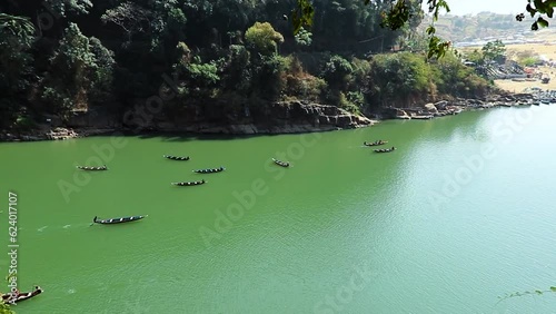 traditional boats many running at mountain river from top angle at day photo