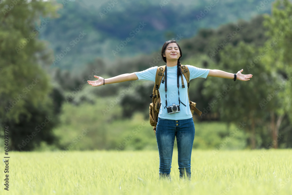 Young people woman traveler and tourism raise arms trips travel on hatchback car to destination leisure travel on the road forest in holiday vacations. Happy and Enjoy trip adventure. Travel Concept Young people woman traveler and tourism raise arms trips travel on hatchback car to destination leisure travel on the road forest in holiday vacations. Happy and Enjoy trip adventure. Travel Concept