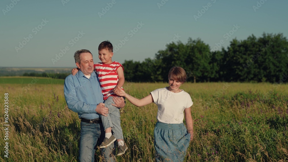 active family lifestyle, happy family park, mother father child son walk park, father mother child travel vacation, smile face, family fun, dad holds his son his arms, father carries his son his arms