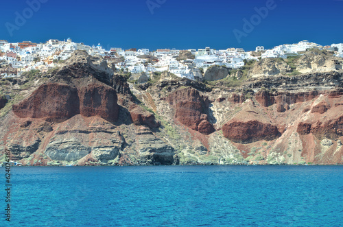 Village on the top of rocky cliff Santorini island - Greece.