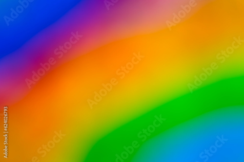Unscharf gestellter Ausschnitt aus einem gemalten Regenbogen als buntes Hintergrundmotiv