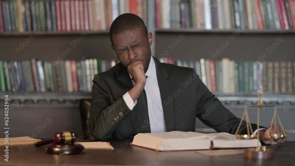 Sick African Male Lawyer Coughing while Reading in Office Sick African Male Lawyer Coughing while Reading in Office