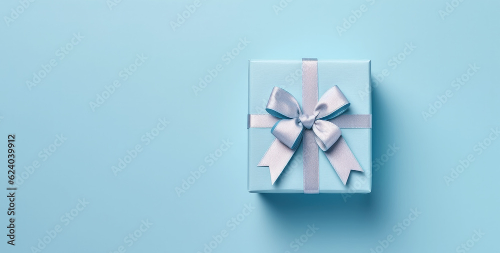 Banner with blue gift box with ribbon and bow for man and boy isolated on blue background.Holiday gift with Birthday or Christmas present,flat lay,top view,father's day,copy space.Generated by AI