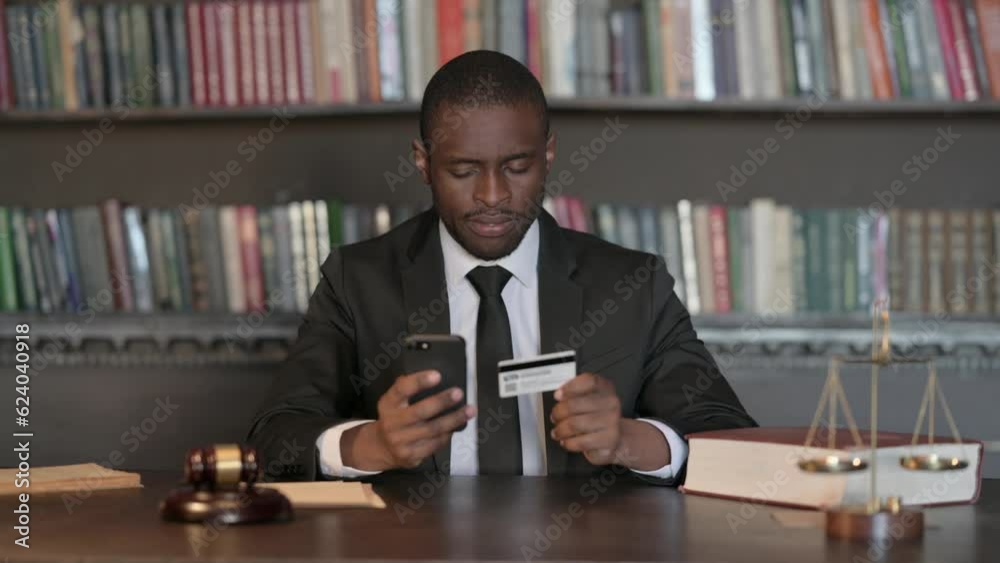 Upset African Male Lawyer Arguing on Phone in Office Upset African Male Lawyer Arguing on Phone in Office