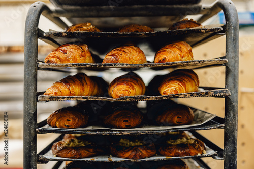 Fresh croissants on bakery tray, fresh from baker's oven