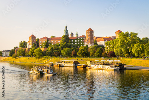 Idyllic Krakow city centre in Poland with Wawel castle at the Vistula river during sunset