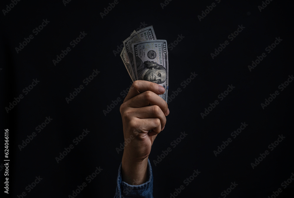Hand holding USD dollar banknote  for dollar exchange , money exchange and inflation interest rating increasing concept. - obrazy, fototapety, plakaty 