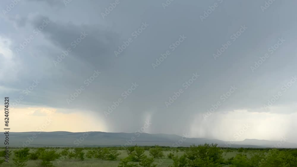 View through window of car in motion on road along field in summer. Tourism and travel, journey trip concept. Beautiful nature and landscape. View through window of car in motion on road along field in summer. Tourism and travel, journey trip concept. Beautiful nature and landscape.