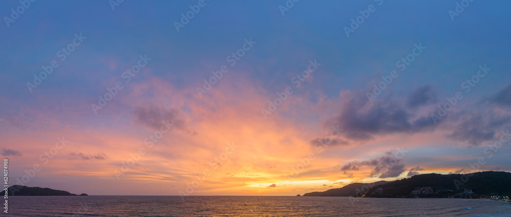 The sky changes color from yellow to red as the sun sets over the sea..sunset landscape amazing light of nature cloudscape sky. .Big sun and red lighting sky background. 4k resolution