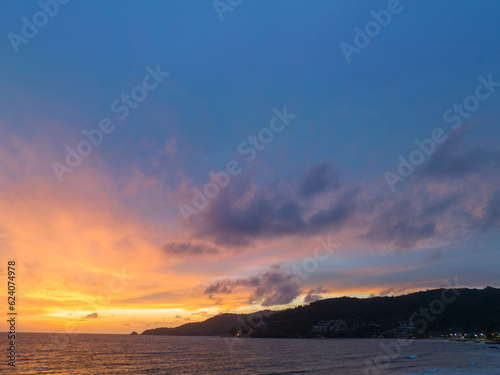 The sky changes color from yellow to red as the sun sets over the sea..sunset landscape amazing light of nature cloudscape sky. .Big sun and red lighting sky background. 4k resolution