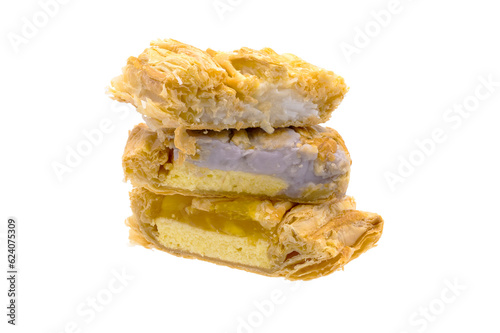 pineapple pie  and taro pie and coconut pie stacked in a pile on white background closeup