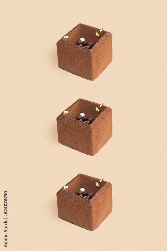 Fototapeta premium Chocolate mousse cake pattern on beige background